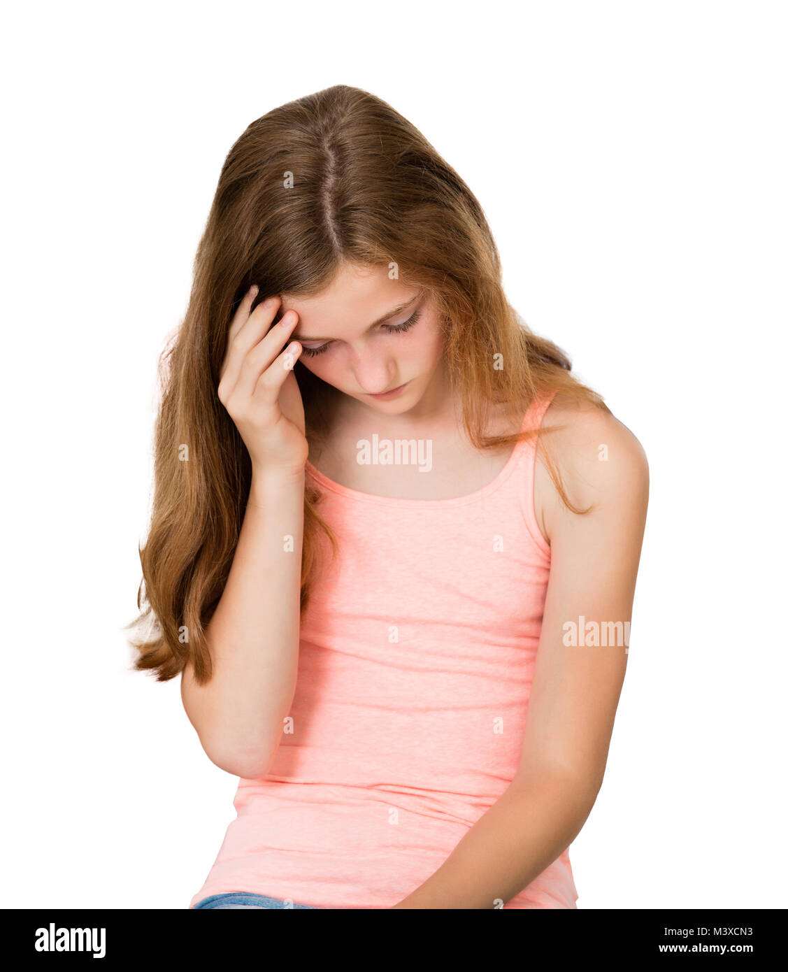 Close-up Of An Unhappy Girl On White Background Stock Photo
