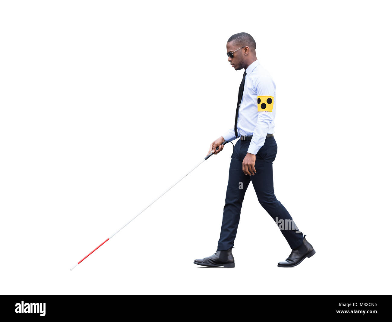 African Blind Man Wearing Armband Walking With Stick On White Background Stock Photo