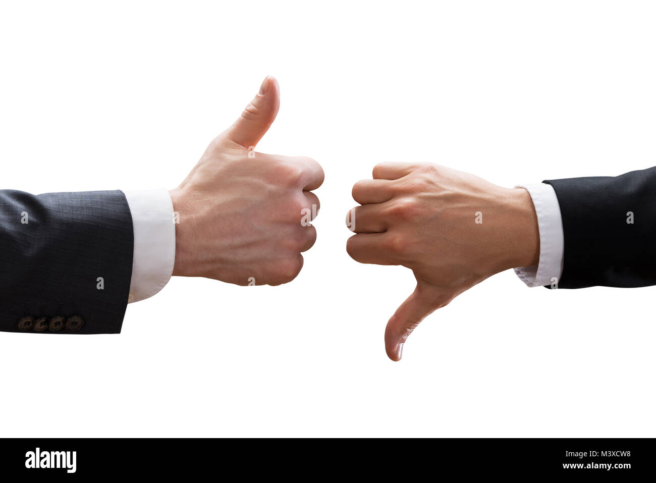 Close-up Of Two Businesspeople Hands Showing Thumb Up And Thumb Down Sign Over White Background Stock Photo