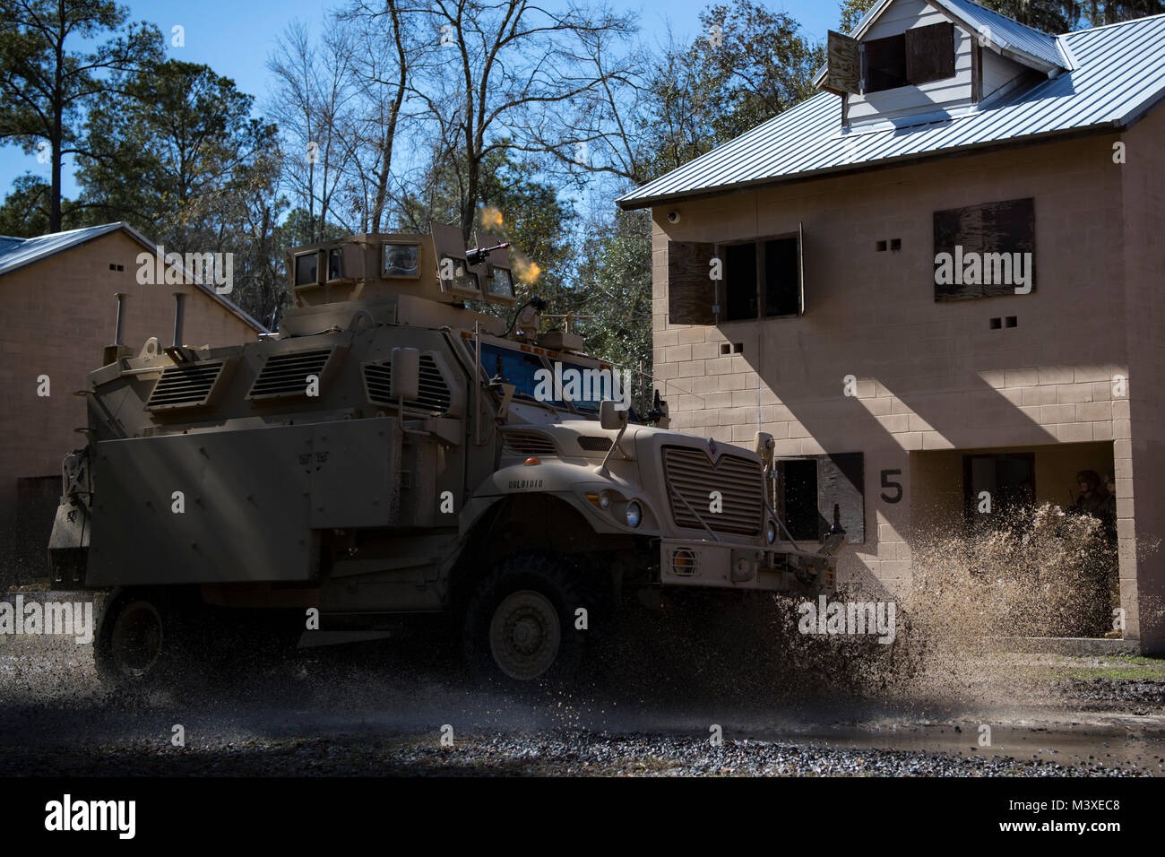 Airmen assigned to the 820th Base Defense Group drive a mine-resistant, ambush-protected vehicle during a capabilities demonstration, Feb. 5, 2018, at Moody Air Force Base, Ga. The immersion was designed to give the 23d Wing’s leadership a better understanding of the 820th BDG’s mission, capabilities and training needs. (U.S. Air Force photo by Senior Airman Daniel Snider) Stock Photo