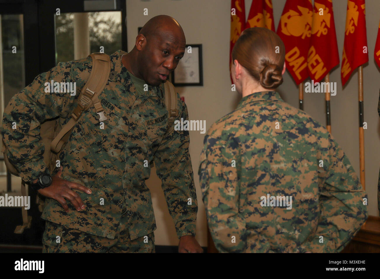 U.S. Marine Corps Sgt. Maj. Ronald L. Green, Sgt. Maj. of the Marine Corps, and Sgt. Sarah Steiert, Motor transportation Chief with 8th Marine Corps Recruiting District, engaging in a conversation on Naval Air Station Joint Reverse Base on February 6, 2018. The 8th Marine Corps Recruiting District is the largest district, covering over 1 million square miles in 13 states. (U.S. Marine Corps photo by Sgt. Clarence A. Leake) Stock Photo
