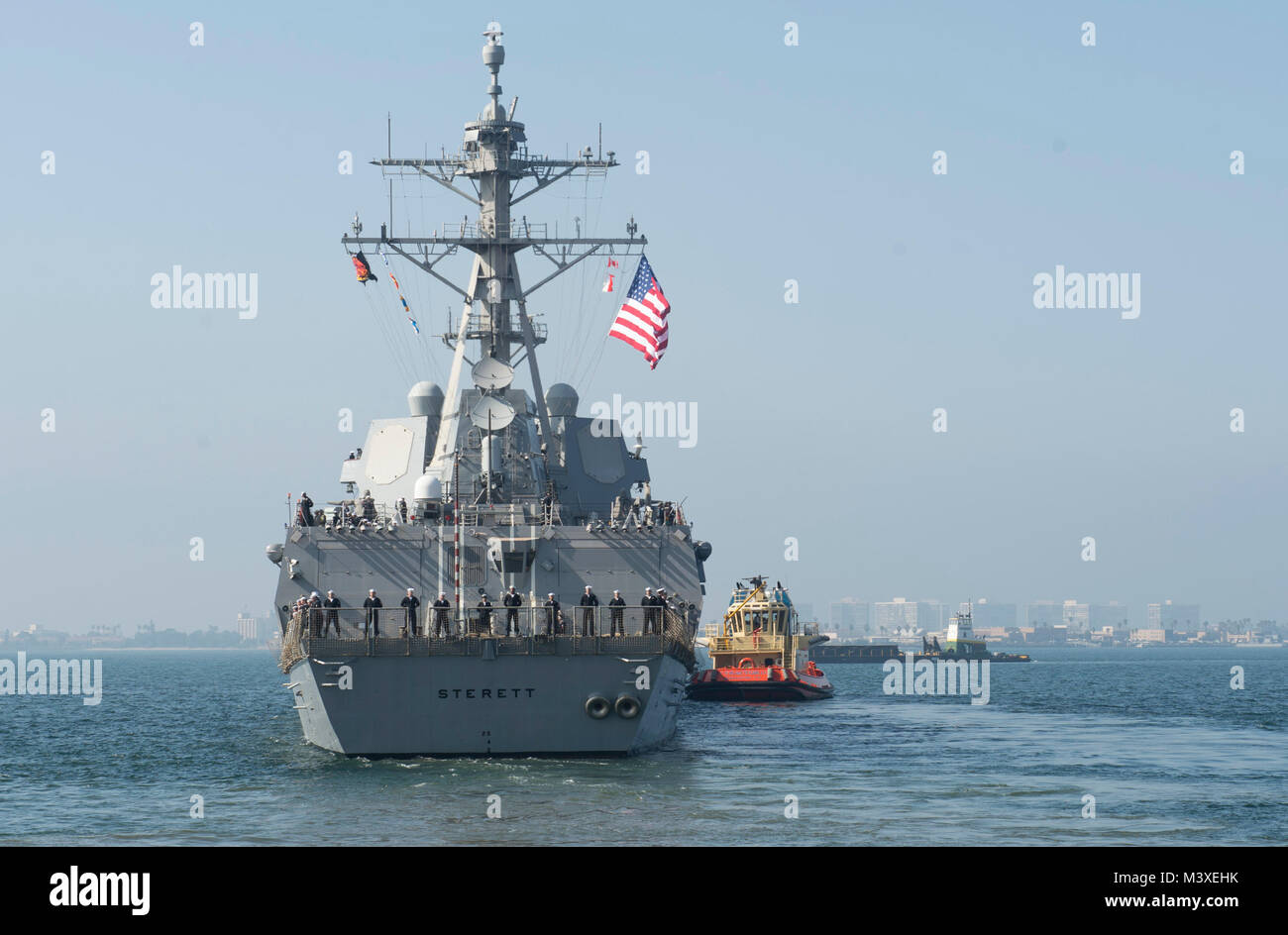 180206-N-HS117-0002  (SAN DIEGO) Arleigh Burke-class guided-missile destroyer USS Sterett (DDG104), along with USS Dewey (DDG 105), departed Naval Base San Diego for a scheduled deployment to conduct operations in the Indo-Pacific Region, Feb. 6. Dewey and Sterett will also support the Wasp Expeditionary Strike Group deployment in order to advance U.S. Pacific Fleet's Up-Gunned ESG concept and will train with forward-deployed amphibious ships across all mission areas. (U.S. Navy video by Mass Communication Specialist Seaman Apprentice Jeffery L. Southerland/RELEASED) Stock Photo
