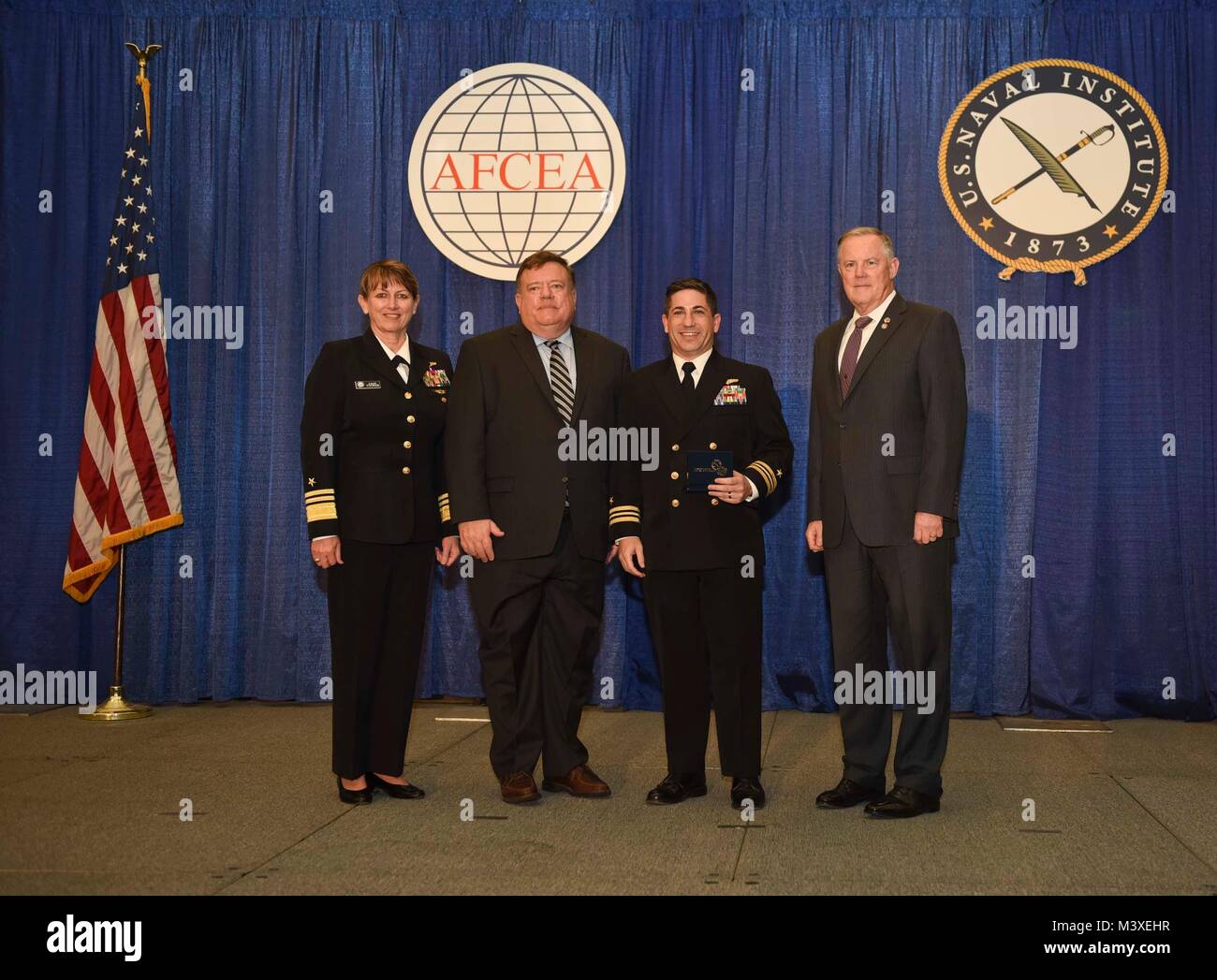 SAN DIEGO (February 6, 2018) From left; Vice Adm. Jan Tighe, deputy chief of naval operations for information warfare/director of naval intelligence; retired Vice Adm. Peter Daly, CEO of the U.S. Naval Institute; Lt. Cmdr. Chris Weiss, deputy branch chief for future capabilities development at U.S. Fleet Cyber Command/U.S. 10th Fleet; and retired Lt. Gen. Robert Shea, president and CEO of the Armed Forces Communications and Electronics Association (AFCEA) International, pose for a photo during AFCEA/USNI’s 2018 Copernicus Award ceremony. Weiss is a 2018 recipient of the Copernicus Award indivi Stock Photo