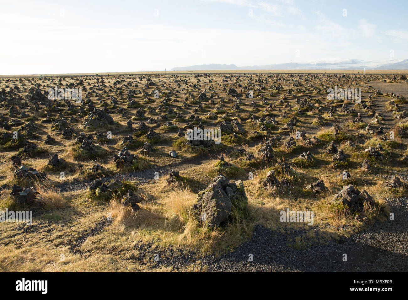 Laufscalavarda, a lava ridge, surrounded by stone cairns - South Iceland Stock Photo