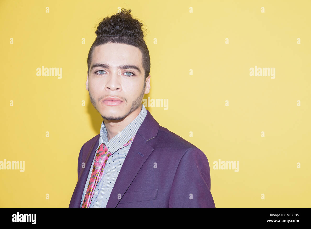 Handsome Mixed Race Young Man In A Trendy Purple Suit Isolated On