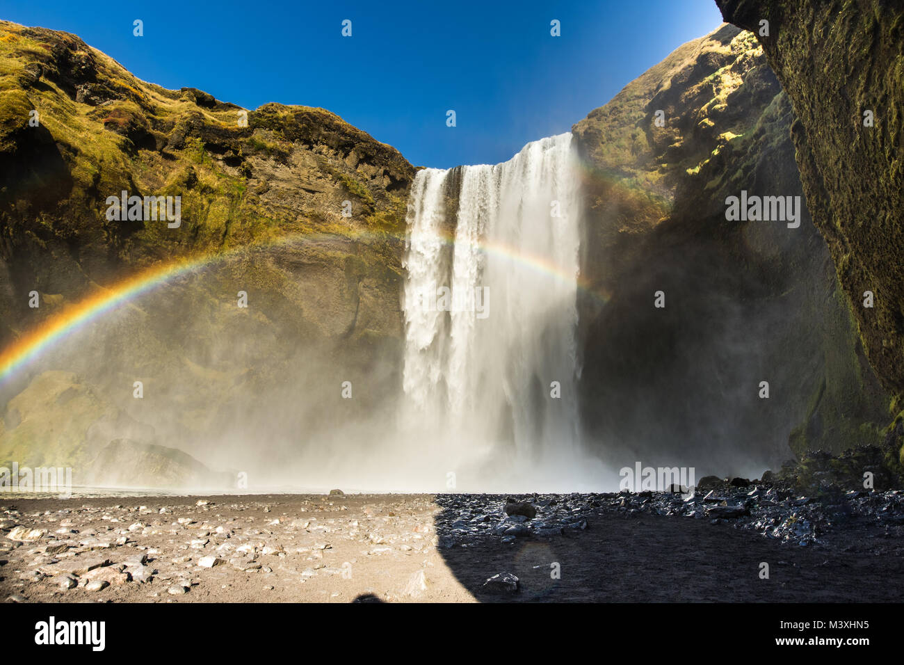 Skogafoss iceland waterfall with a rainbow and a beautiful sky in southern iceland europe Stock Photo