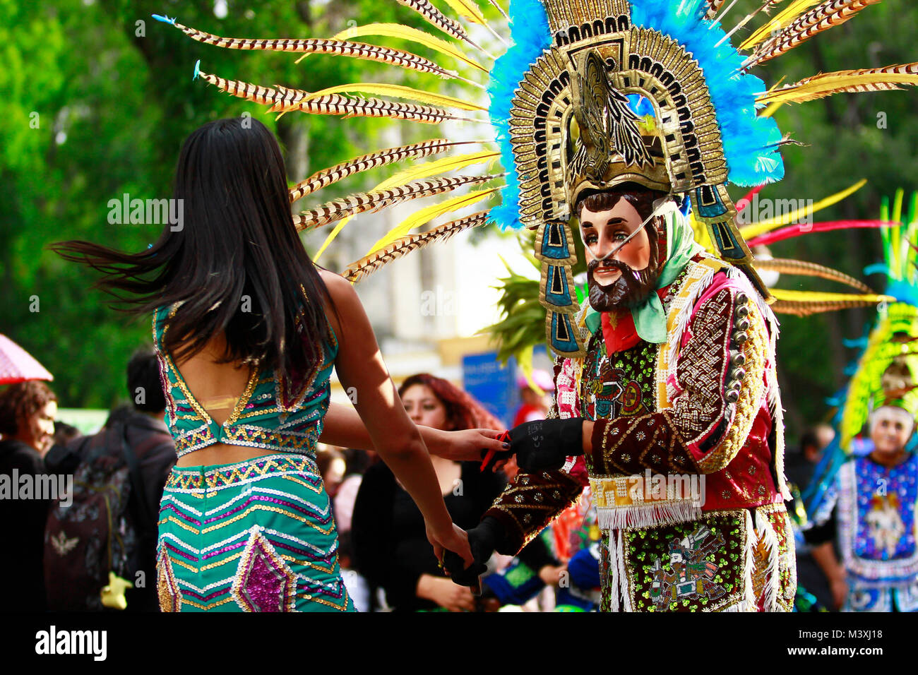 TLAXCALA, MEXICO - FEBRUARY, 08, 2018 A mexican couple of mexican dancers with bright mexican folk costumes during the annual parade to celebrate the Stock Photo