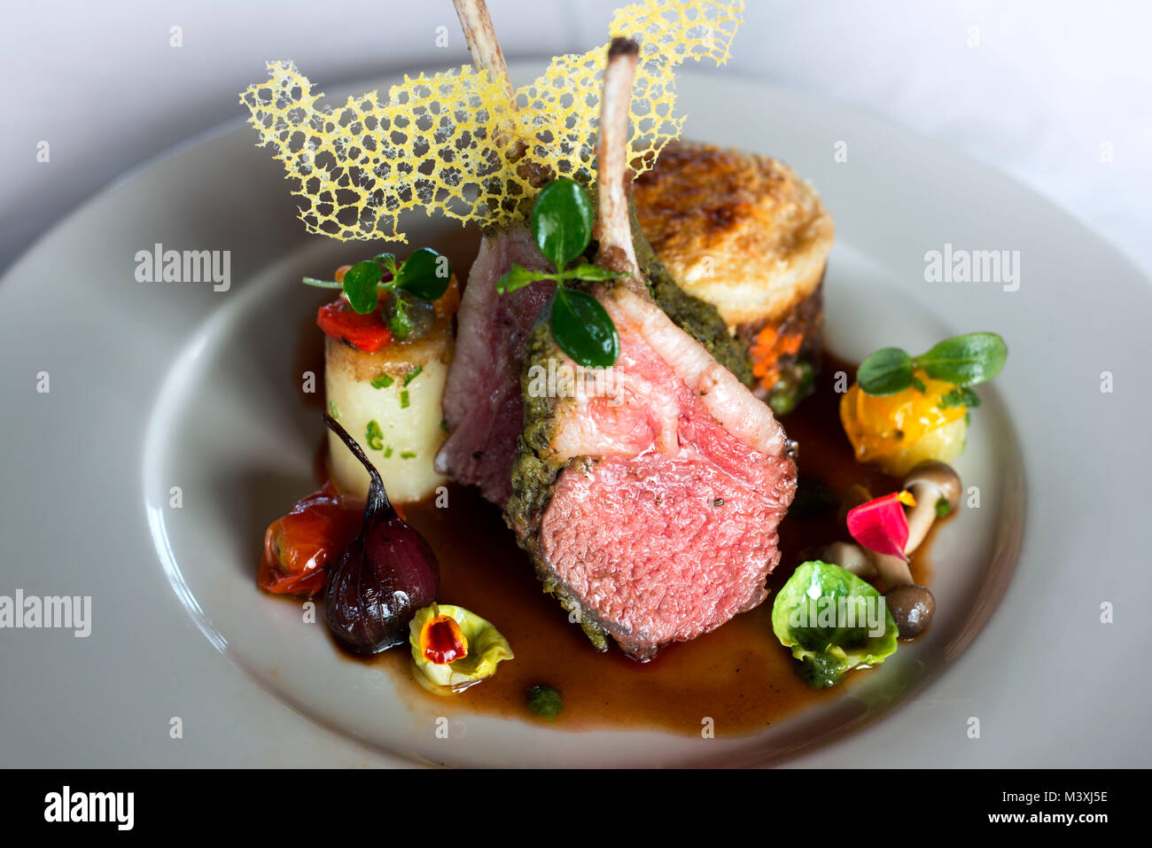 Delicious typical rack of lamb dish of Maldivian cuisine. The Residence Hotel and Resort restaurant, Gaafu Alifu Atoll. Maldives Islands. Stock Photo