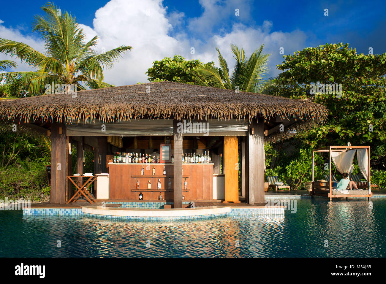 Swimming pool and bar in The Residence Hotel and Resort, Gaafu Alifu Atoll. Maldives Islands. Stock Photo