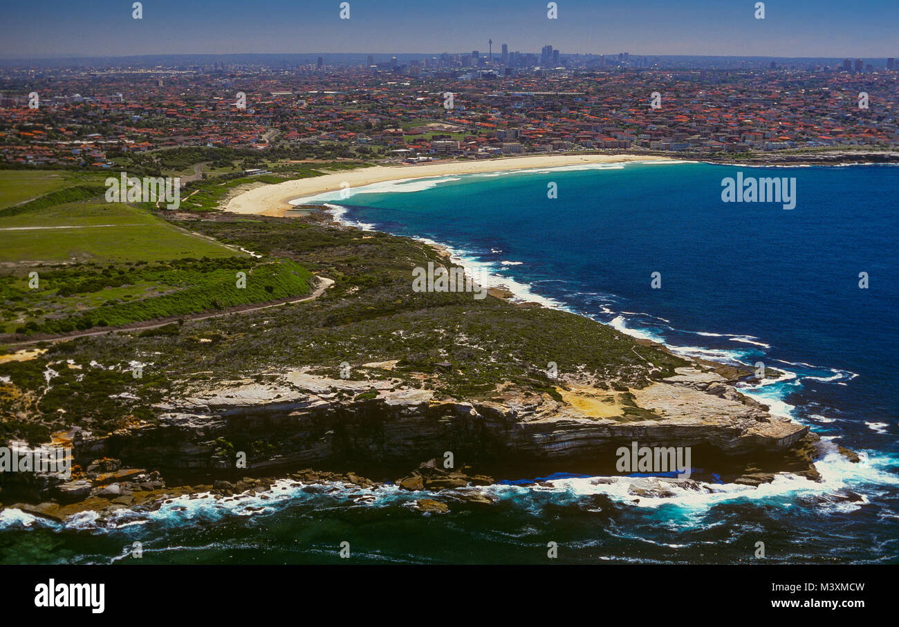 An aerial view of Maroubra Beach and the City of Sydney, Australia, seen from Magic Point (bottom right) at Malabar Headland National Park. Stock Photo