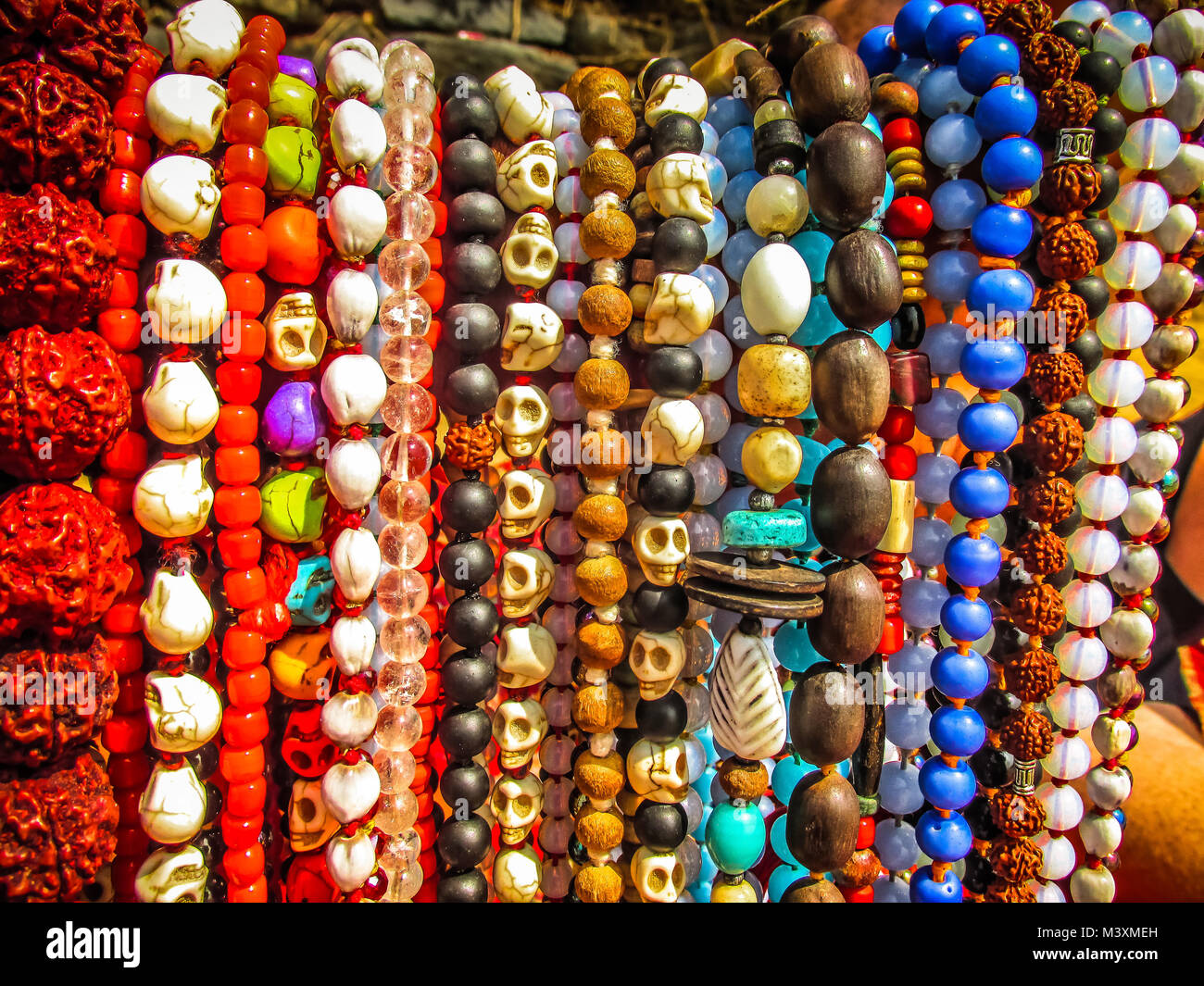 Colorful jewelry sold on the beach in southern India Stock Photo - Alamy