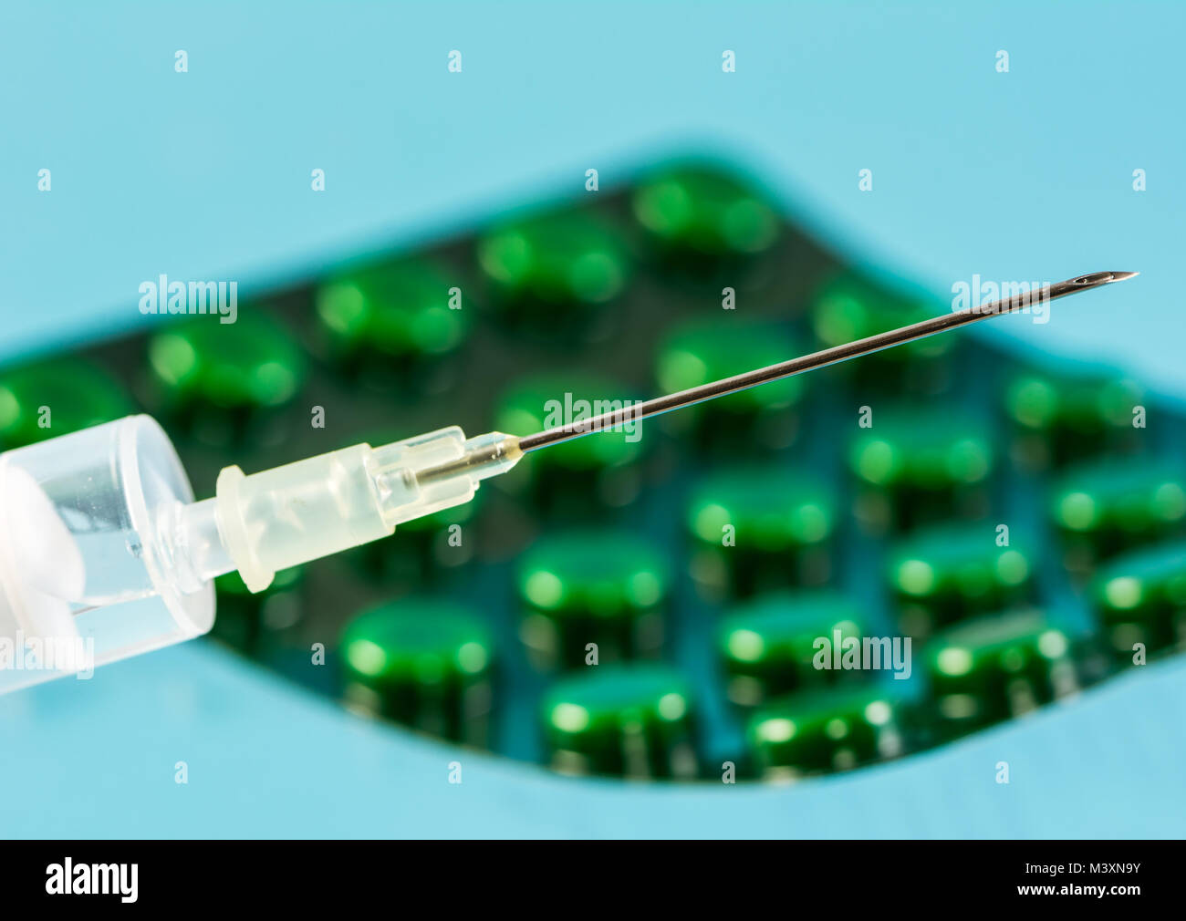 Closeup of a syringe and a blister pack with tablets Stock Photo Alamy