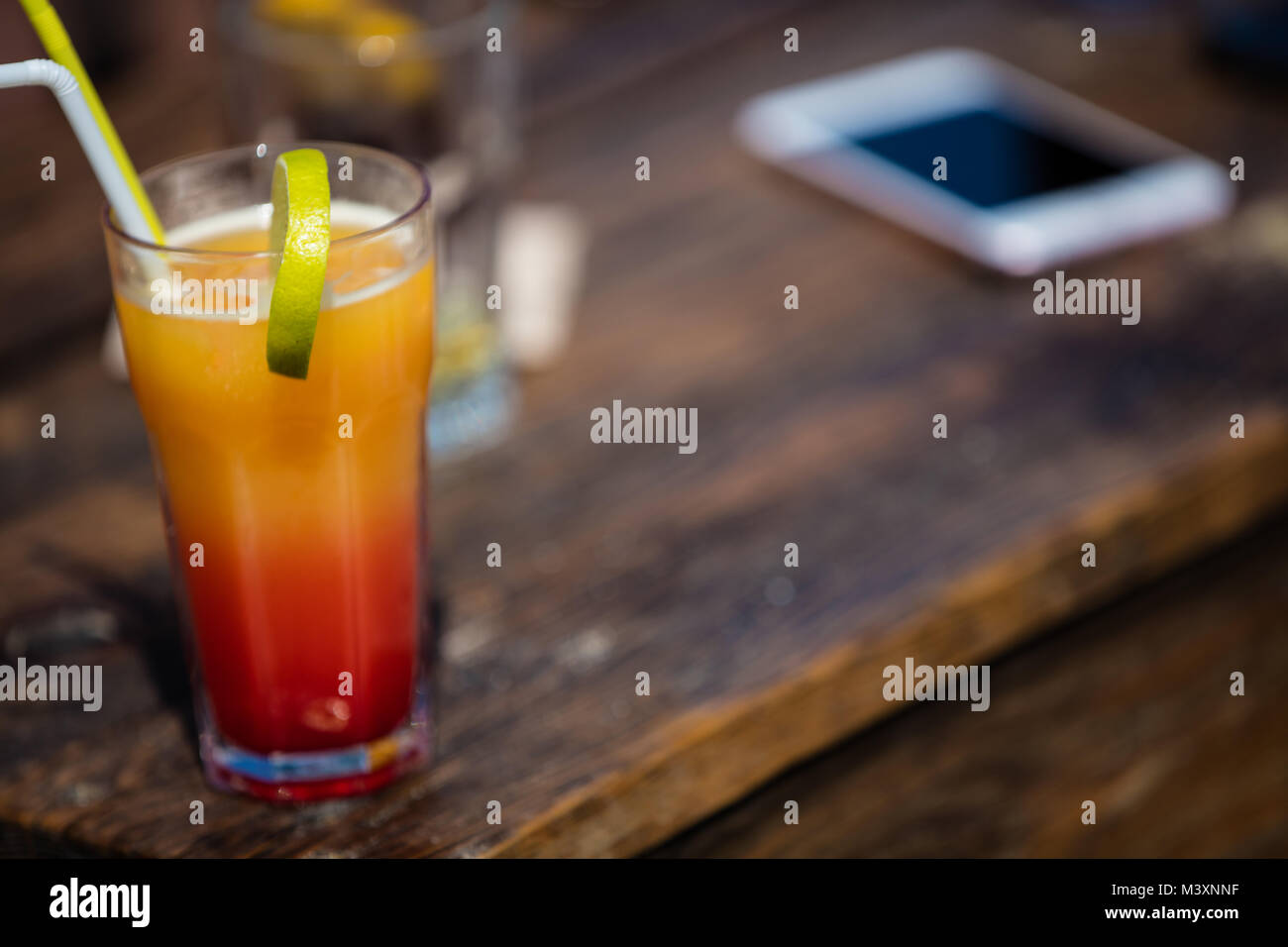 Orange cocktail on rustic wooden table.Alcohol orange daiquiri cocktail
