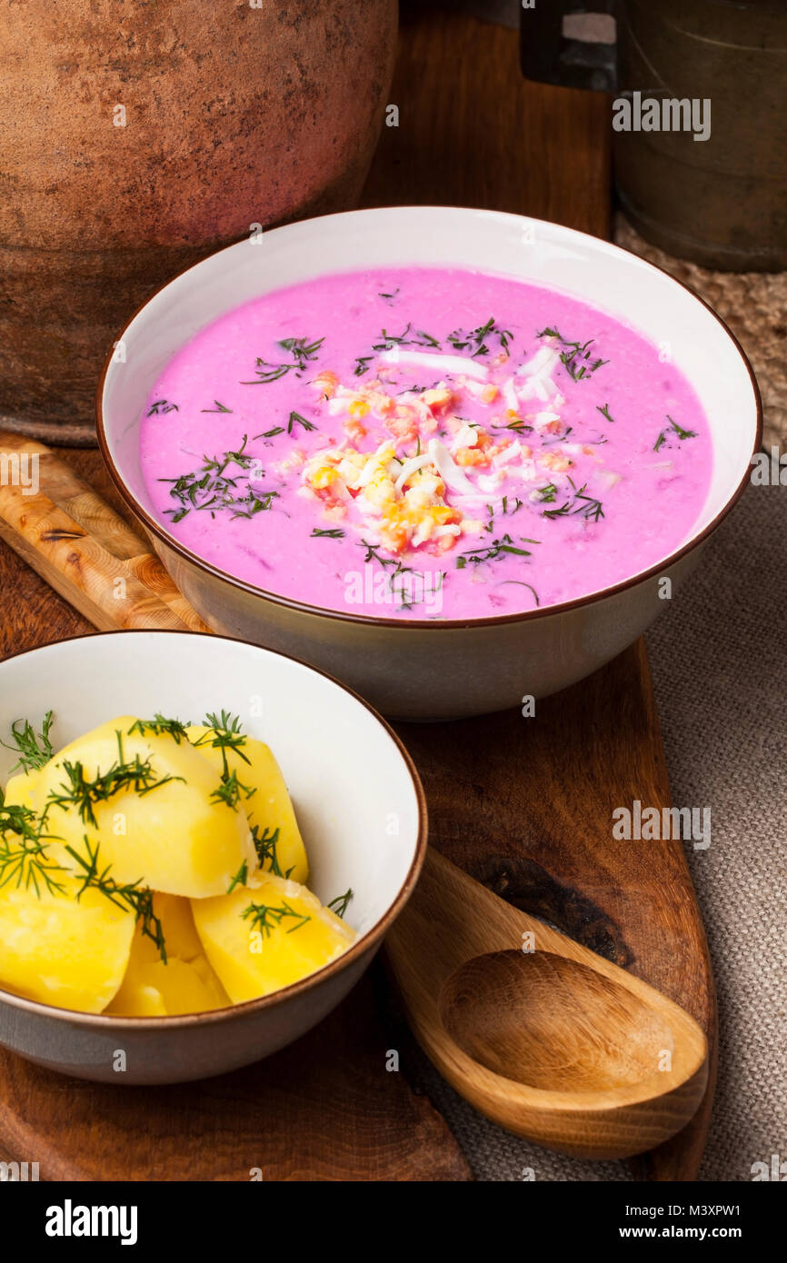 Traditional lithuanian cold beet pink soup, prepared of cucumber, beetrot, eggs and sour cream, called saltibarsciai Stock Photo