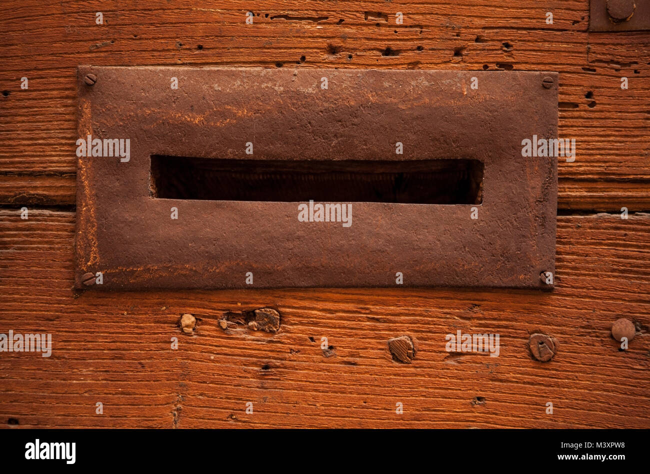 Close-up details of an antique hole for mail on the door. Rome, Italy. Stock Photo