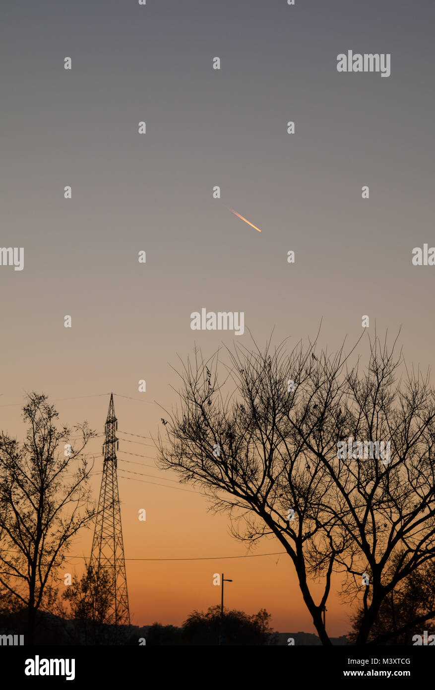 silhouette of transmission tower and trees in sunset Stock Photo - Alamy