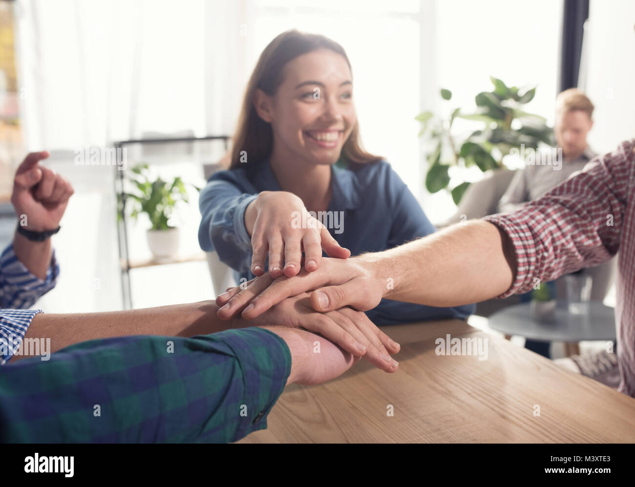 Business people putting their hands together. Concept of teamwork and partnership Stock Photo