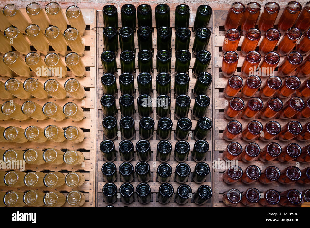 Sparkling wine bottles fermenting in winery Stock Photo