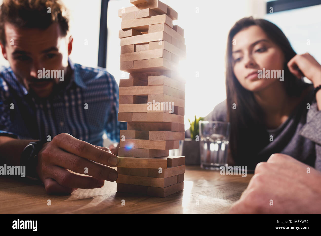 Team of business people build a wooden construction. concept of teamwork ,partnership and company startup Stock Photo