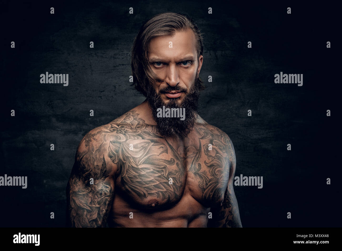 Portrait of a man with tattooed body Stock Photo - Alamy