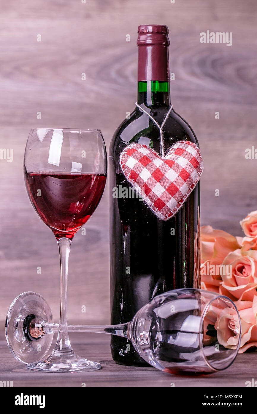 Red Wine Bottle Two Glasses Of Wine Rose With Decoration By Red