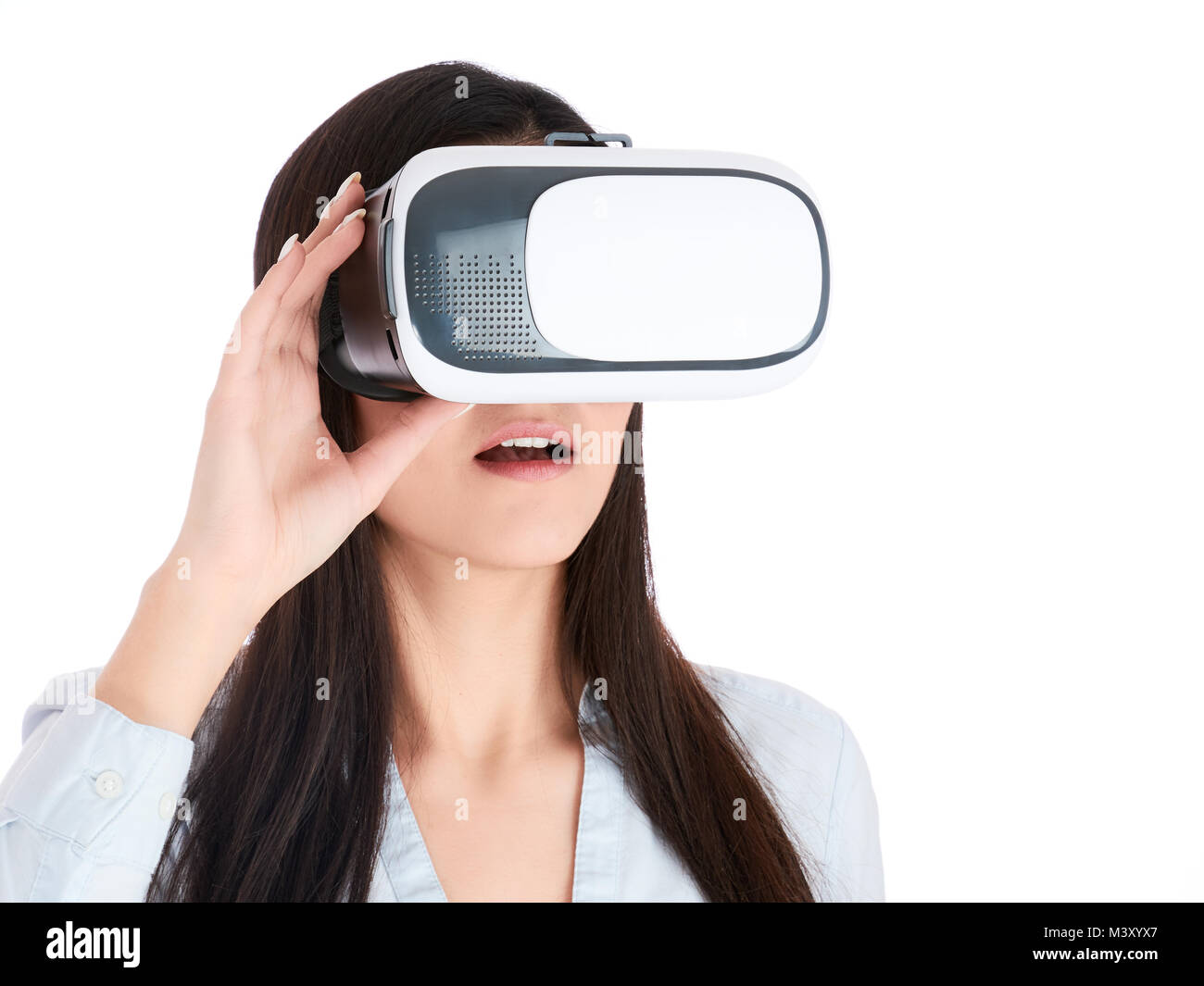 Young woman is using VR headset isolated on white background Stock ...