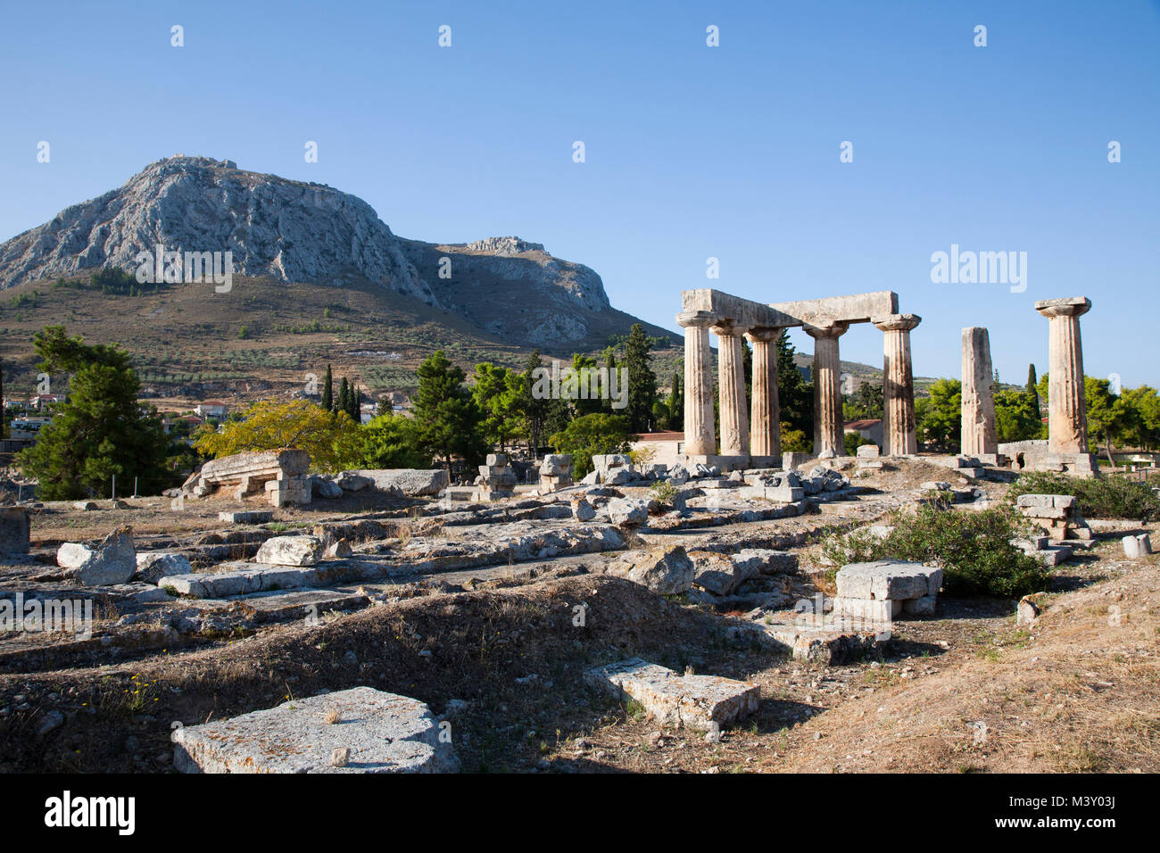 Europe, Greece, Peloponnese, ancient Corinth, archaeological site, view with the Temple of Apollo Stock Photo