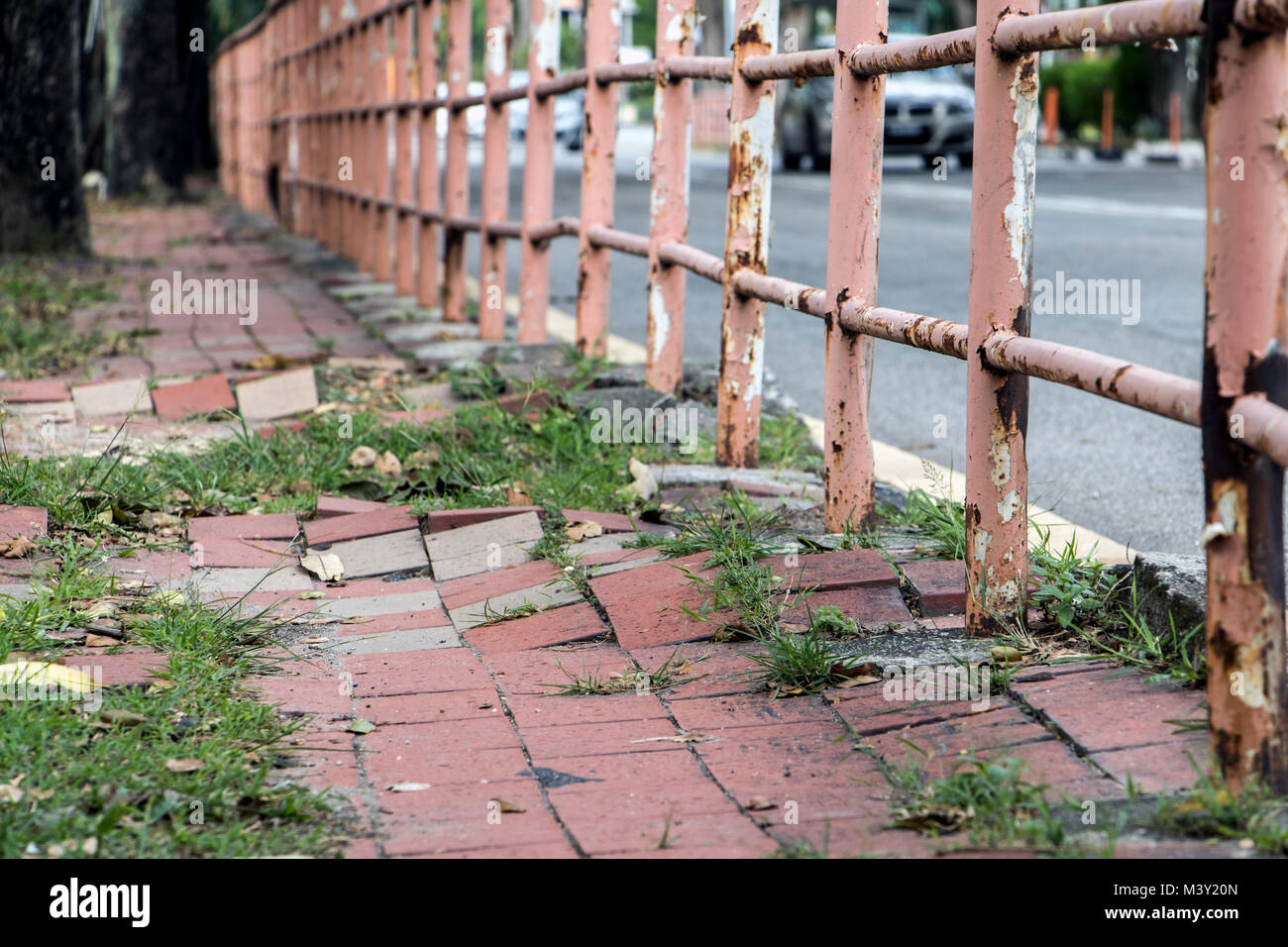 Broken walkway in Penang city. Damaged pavement on street. Stock Photo