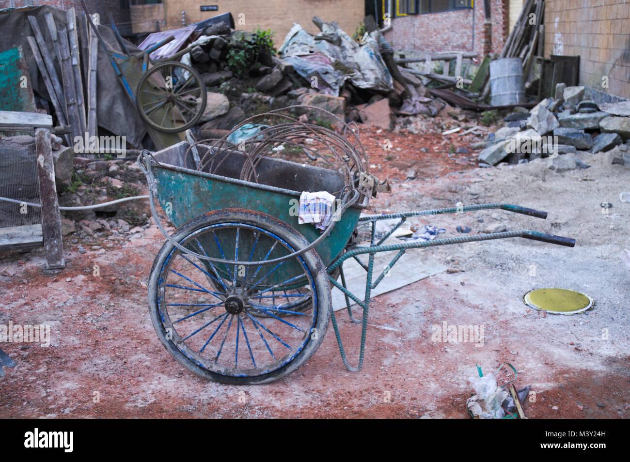 Isolated wheelbarrow on the street (Yunnan, China Stock Photo Alamy