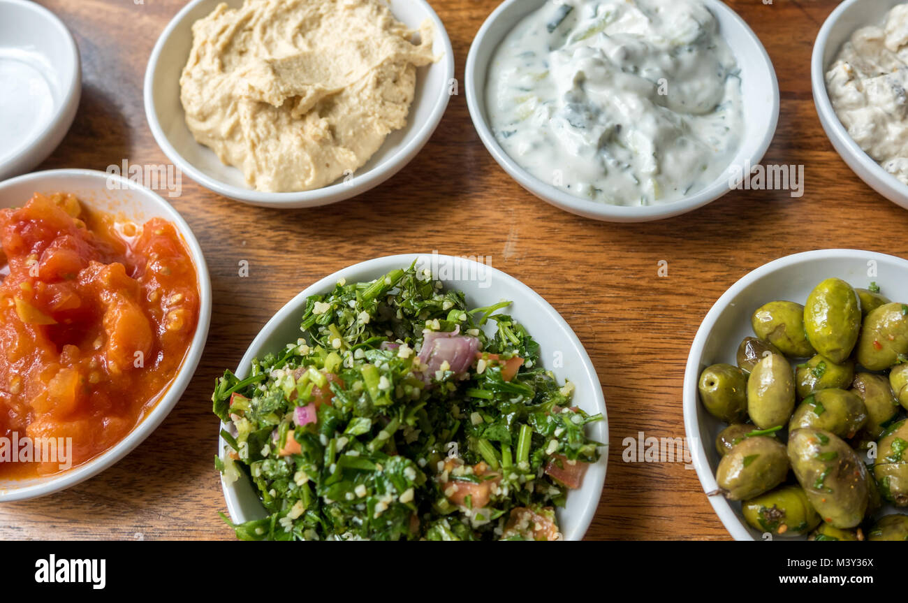 Various Middle East Dip Plates on Wooden Table Stock Photo Alamy