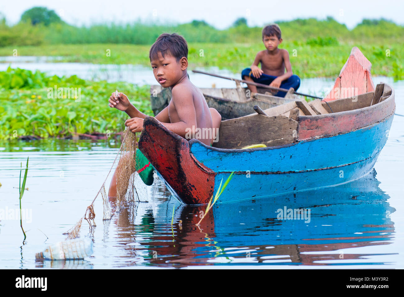 Child in Tonle Sap, Cambodia Stock Image - Image of stand, youth
