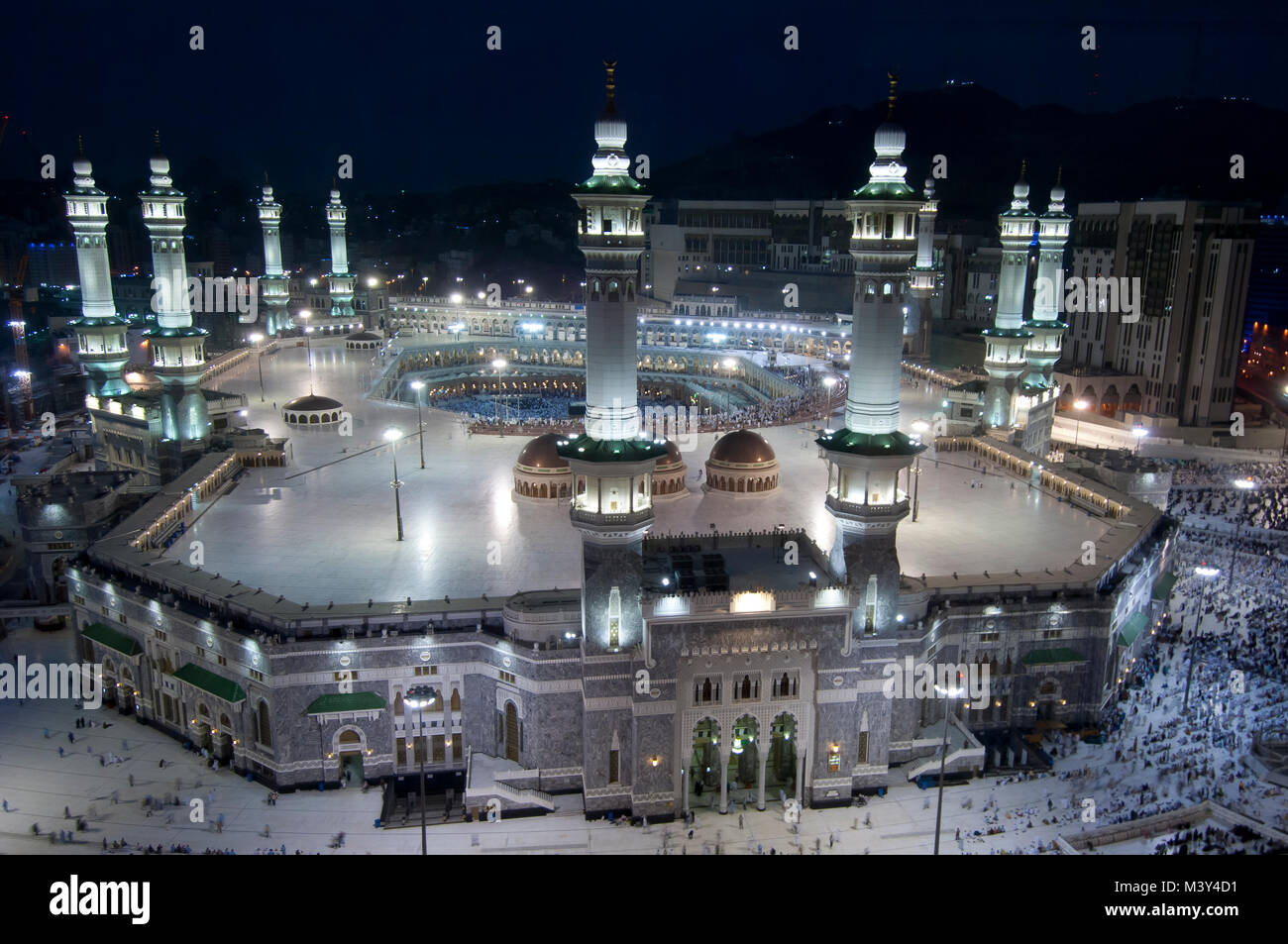 Prayer and Tawaf of Muslims Around AlKaaba in Mecca, Saudi Arabia, Aerial Top View Stock Photo