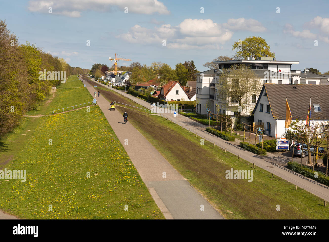 Cycle way on dike at Zingst, Germany Stock Photo
