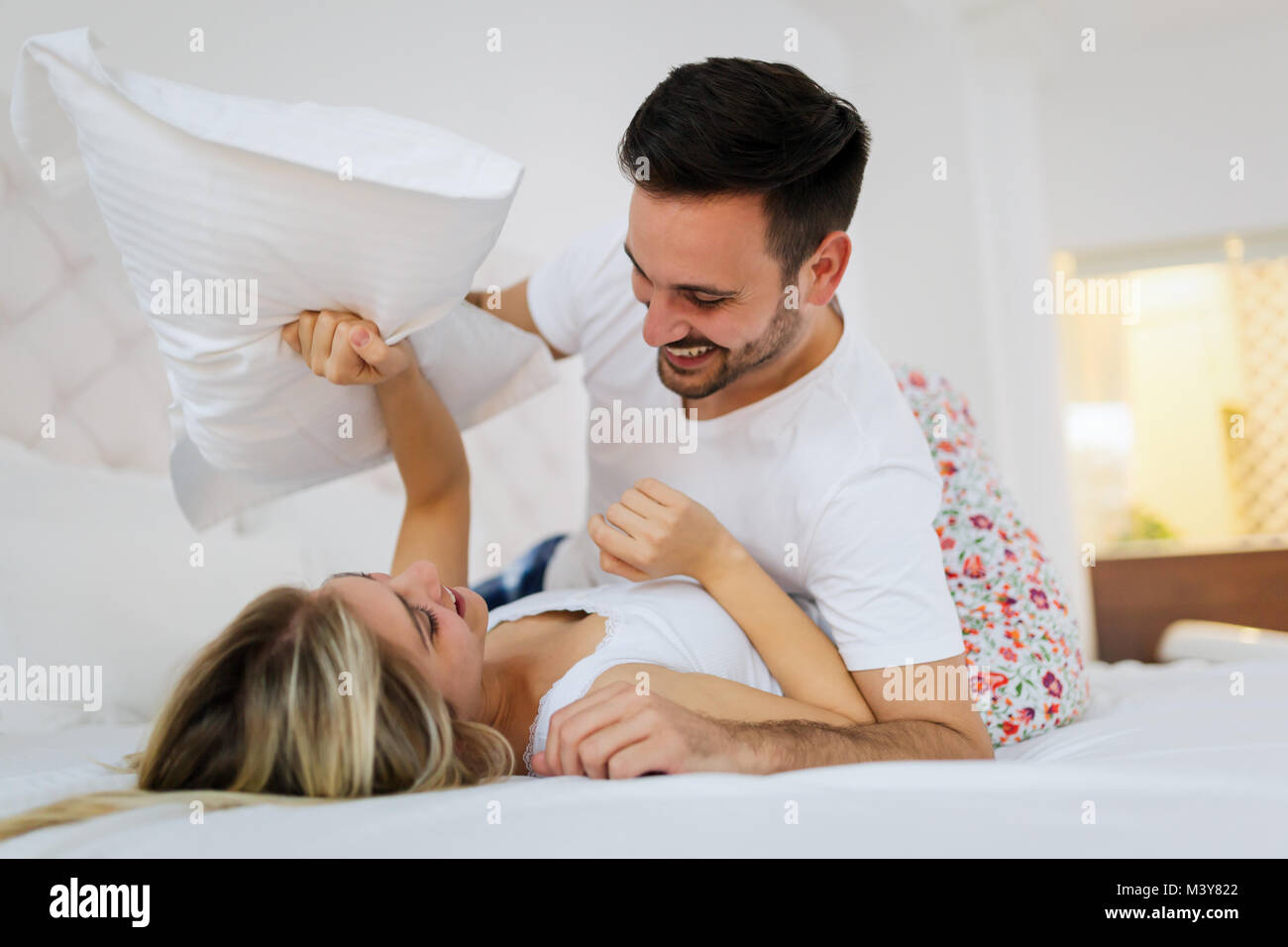 Young couple having having romantic times in bedroom Stock Photo