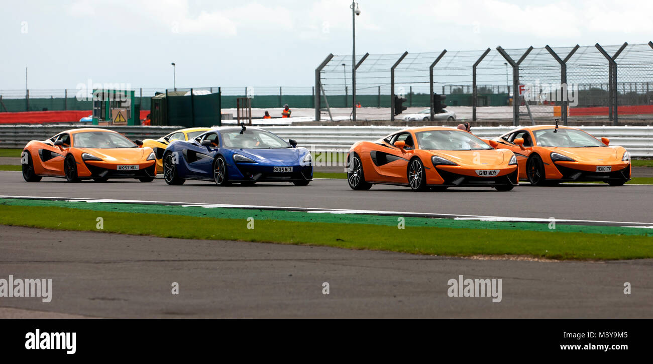 McLaren Sports Cars on a parade lap around the track, during the 2017 Silverstone Classic Stock Photo
