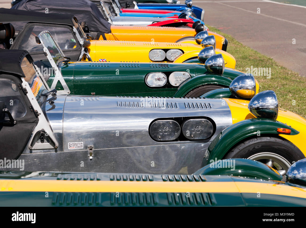 A row of classic Lotus 7's, and Caterham 7s on display in the car club zone of the 2017 Silverstone Classic Stock Photo
