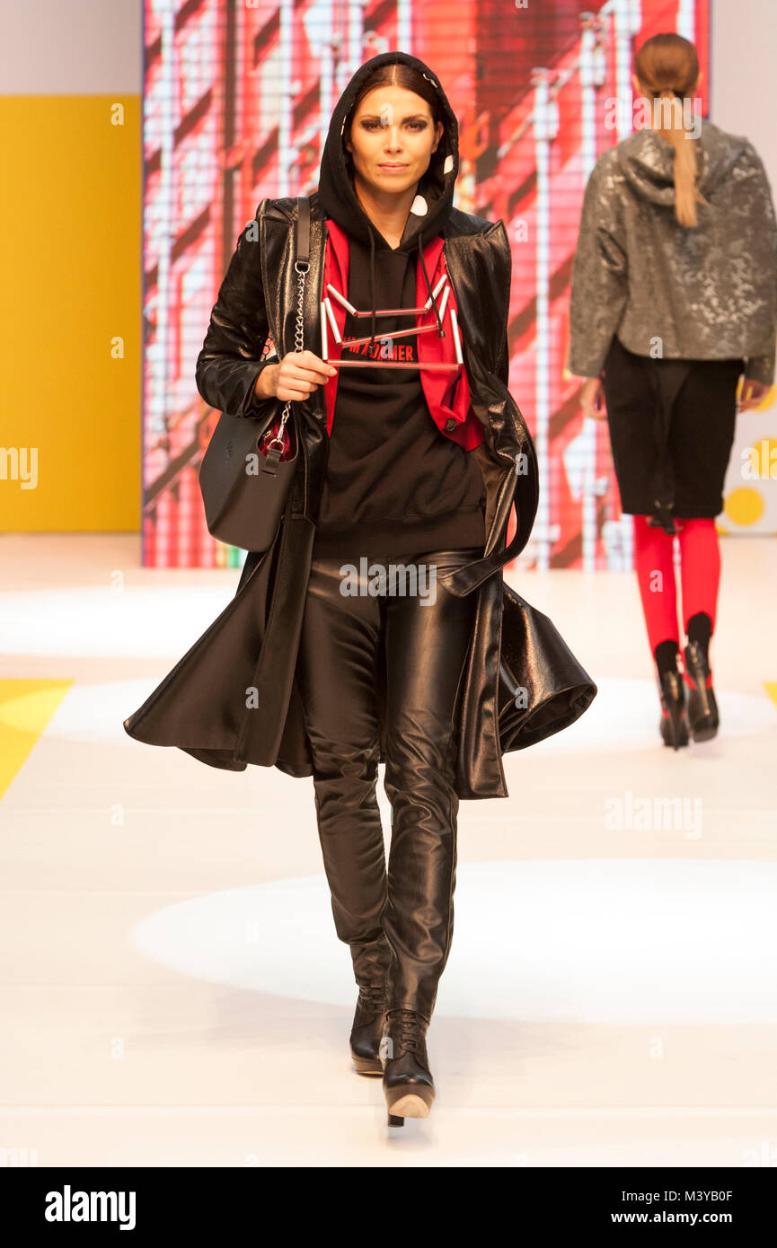 London, UK. 12th Feb, 2018. Pure London A/W 2018/19, Olympia, London, UK. Model wears hoodie by Dream Yourself, jacket by Nissa, and blazer by Coster Copenhagen. Necklace by Christina Brampti. Bag by O Bag. Credit: Antony Nettle/Alamy Live News Stock Photo