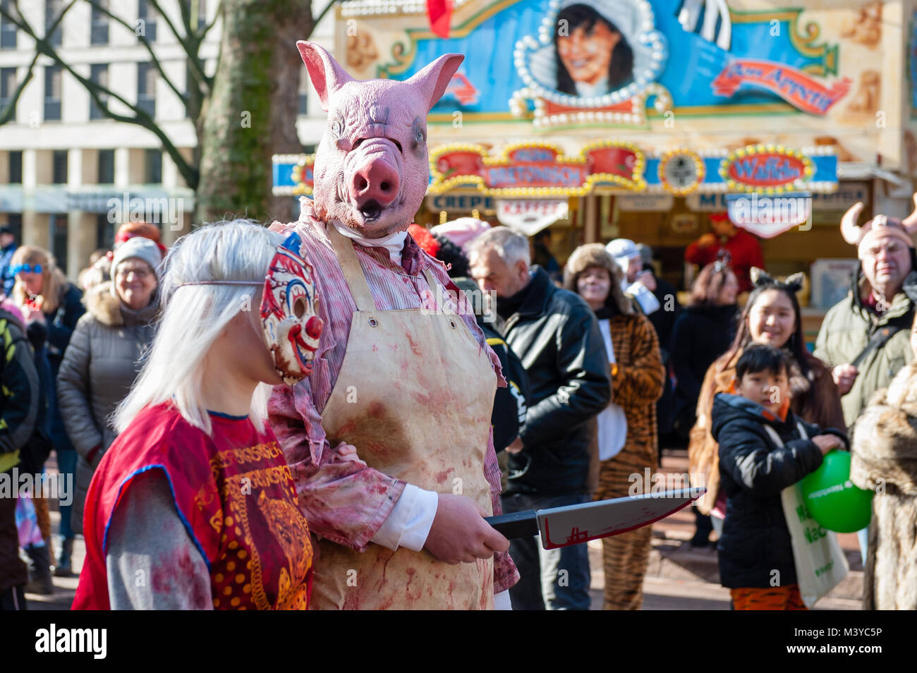 Düsseldorf, Germany, 12 February 2018. The Carnival events features more than 300 Carnival shows, balls, anniversaries, receptions and costume parties. The motto this season is ‘Jeck erst recht’ (Carnival more than ever). The Rose Monday Parade is the culmination of the celebration and gathers 5,000 participants that join the procession through the city. It featuring more than 30 music ensembles and elaborately built and decorated floats addressing cultural and political issues with a satirical, hilarious and controversial mood, such as the famous politically themed floats of Jacques Tilly. Stock Photo