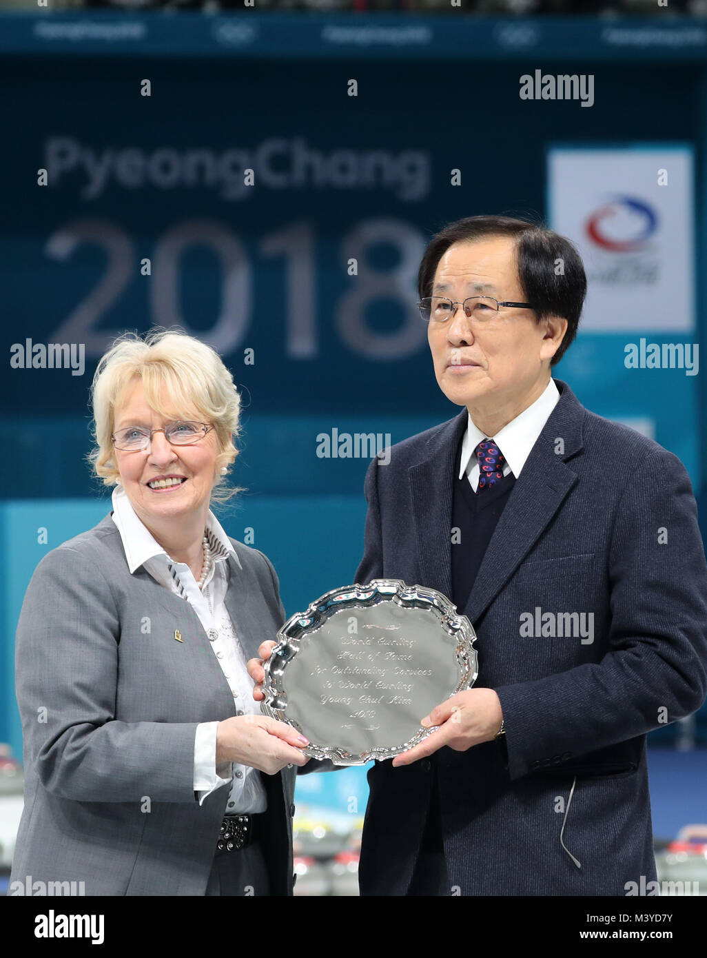 13th Feb, 2018. Korean World Curling Hall of Famer Kim Youngcheol (R