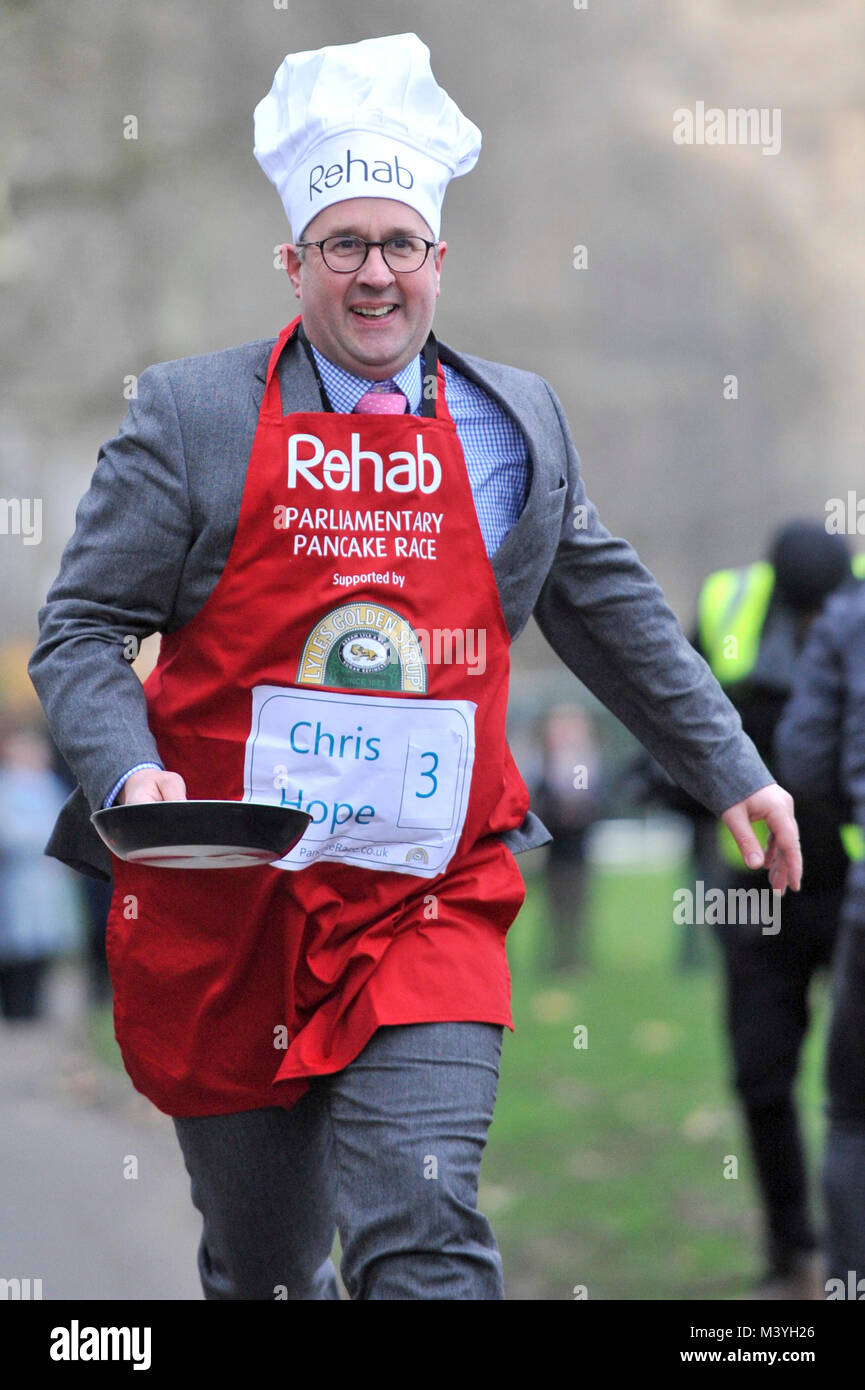 London, UK. 13th Feb, 2018. Chris Hope, The Daily Telegraph, Media Team, takes part in the annual Shrove Tuesday Rehab Parliamentary Pancake Race, supported by Lyle's Golden Syrup, held in Victoria Tower Gardens, Westminster. Credit: Stephen Chung/Alamy Live News Stock Photo