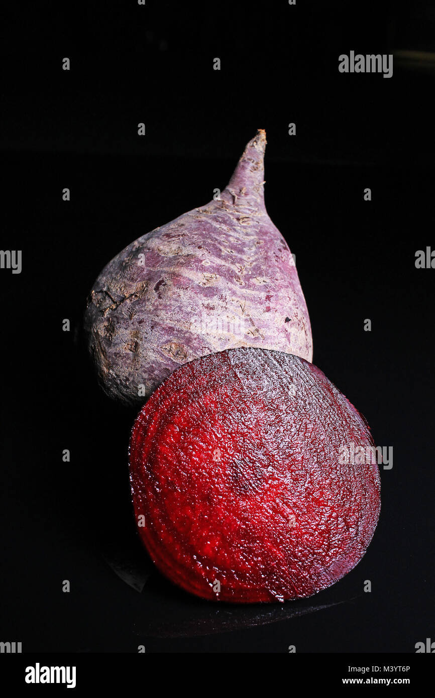 Beetroot beet on black reflective studio background. Isolated black ...