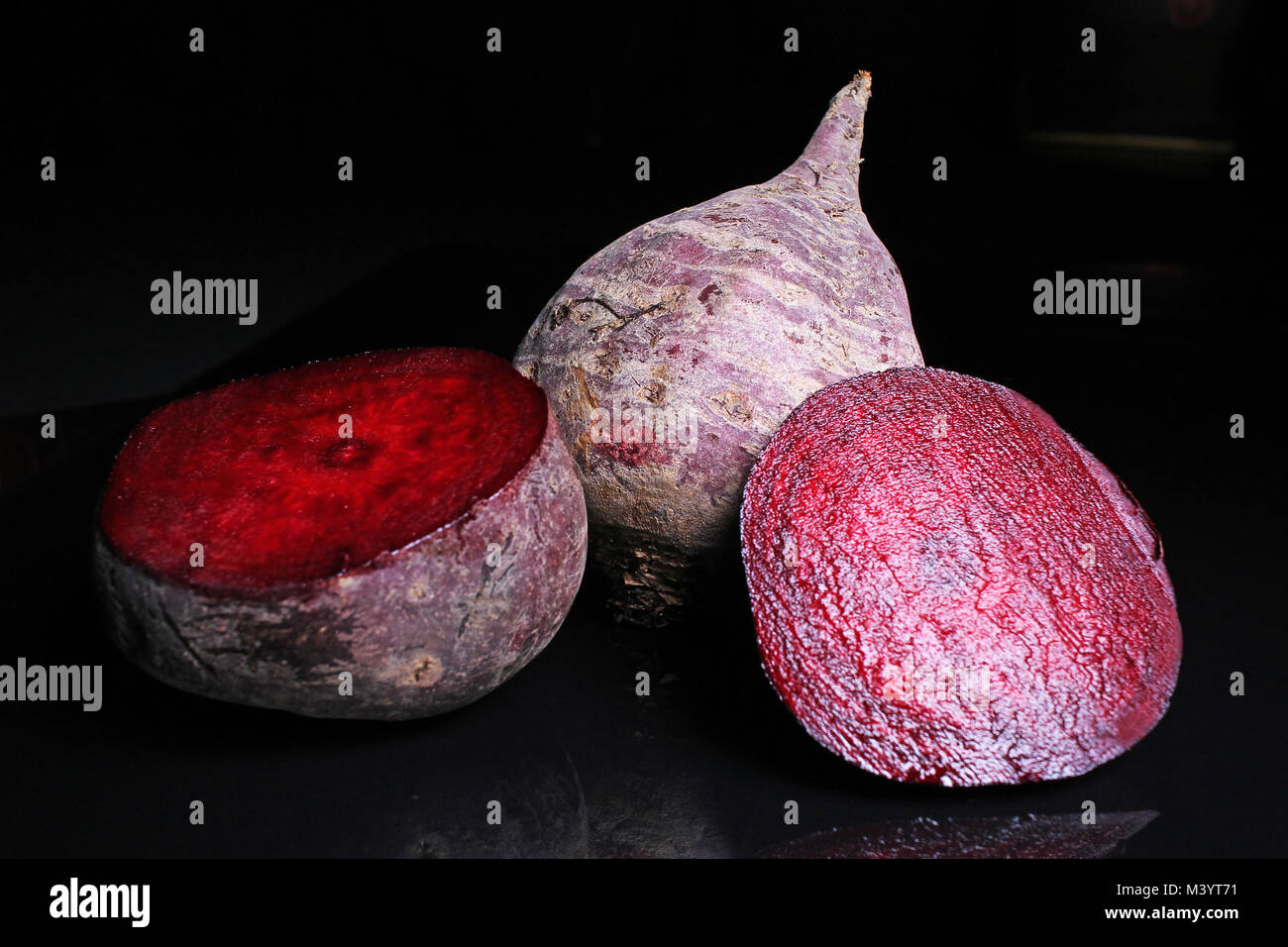 Beetroot beet on black reflective studio background. Isolated black ...