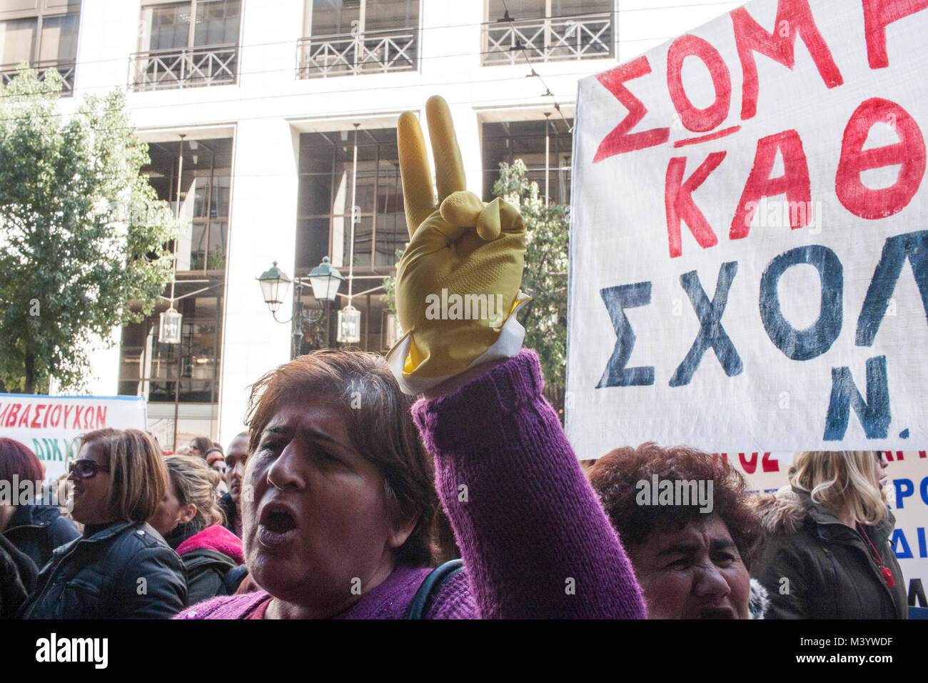 Athens, Greece. 12th Feb, 2018. A demonstrator raises her hand wearing
