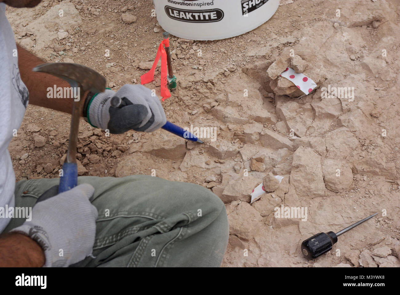 Chiseling Rock At Saber Site. Small pieces of rock are removed from the Saber Site. Stock Photo