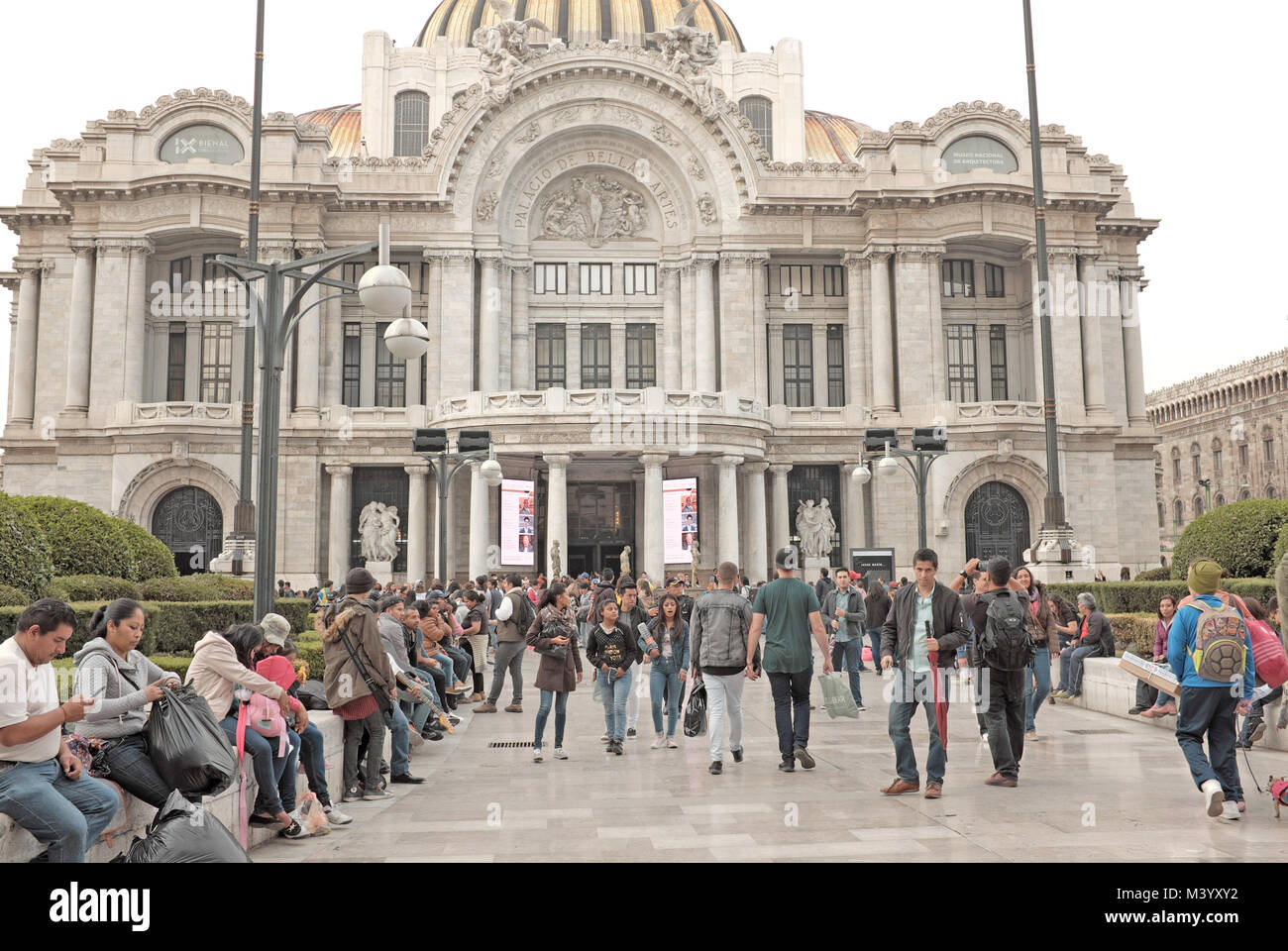 People congregate outdoors in front of the iconic Palacio de Bellas Artes in the centro historico area of Mexico City, Mexico. Stock Photo