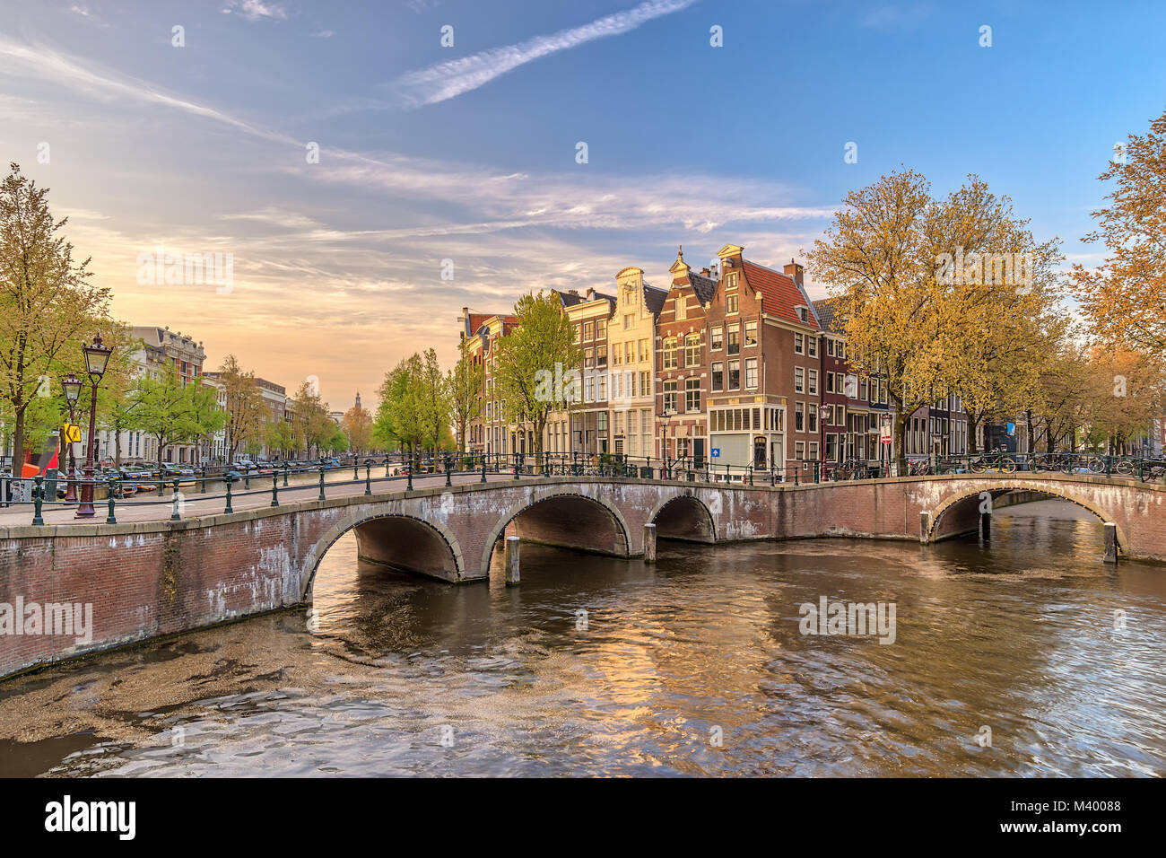 Amsterdam sunset city skyline at canal waterfront, Amsterdam, Netherlands Stock Photo