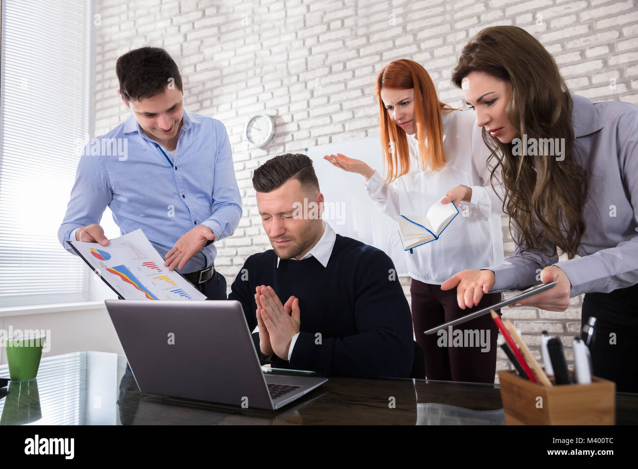 Employee saying sorry to his boss Stock Photo - Alamy