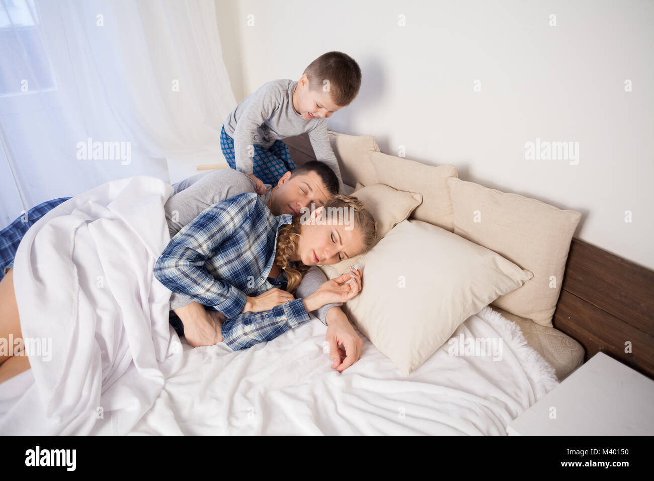 little boy wakes up in the morning, parents 1 Stock Photo Alamy