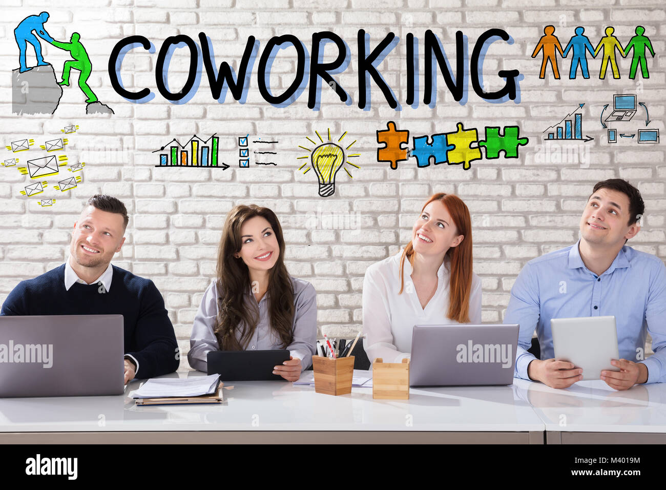 Thoughtful Businesspeople Thinking About Coworking Concept At Workplace In Office Stock Photo
