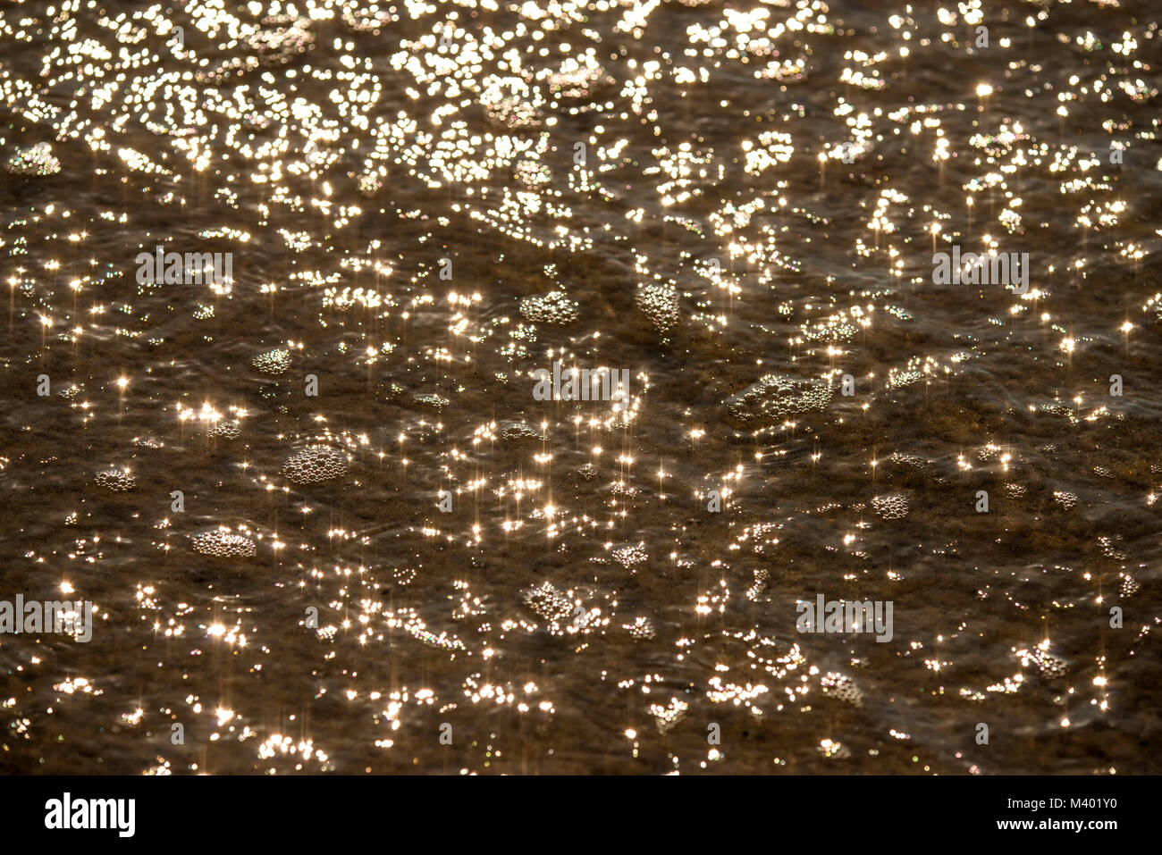 Water of the sea with sun reflections Stock Photo - Alamy